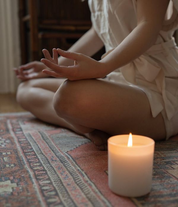 A woman in a peaceful yoga pose, embodying serenity and balance.